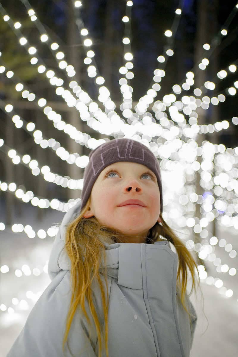 Girl in front of a light display