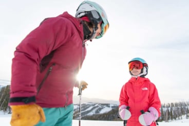Mother and daughter in ski gear