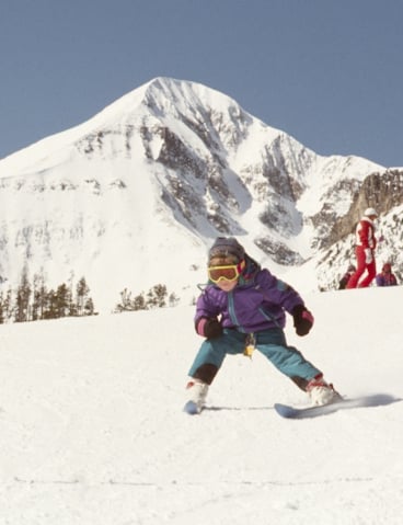 Archive photo of a child skiing on Lone Peak