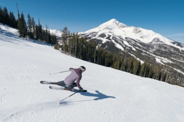 Skier with Lone Mountain in the background