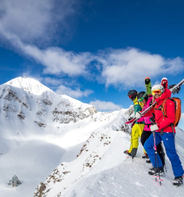 Group standing with ski gear
