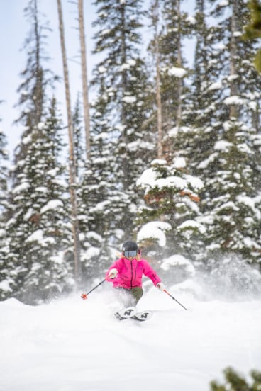 Woman skiing powder