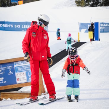 Child in a private ski lesson