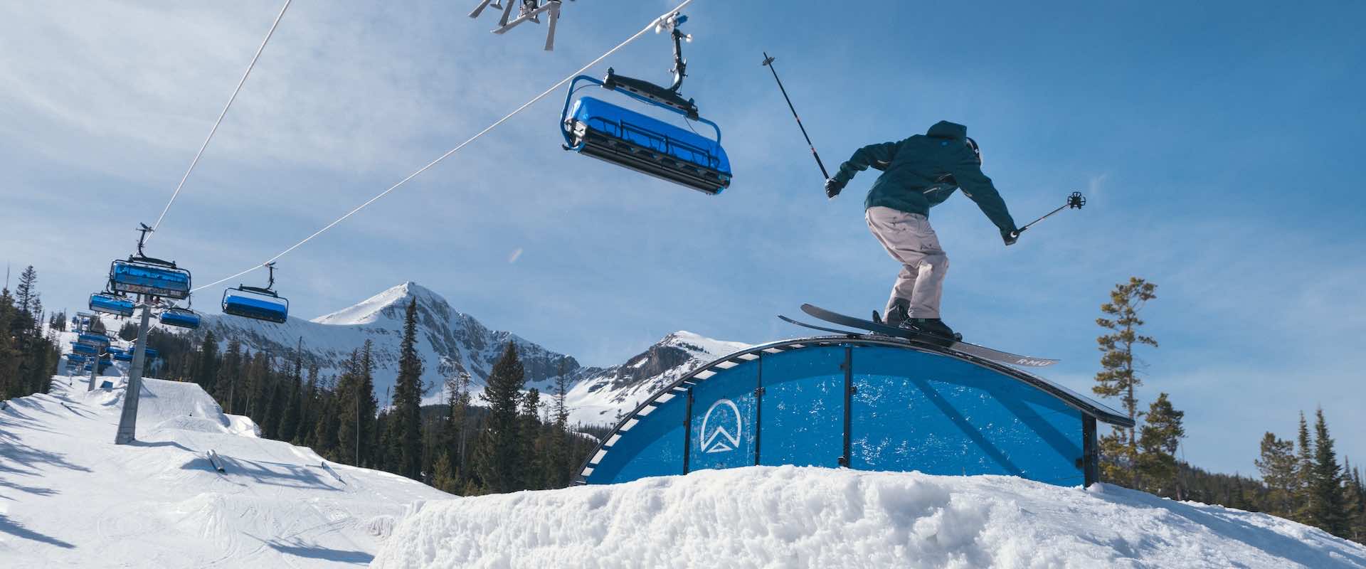 Skier on a terrain park rail